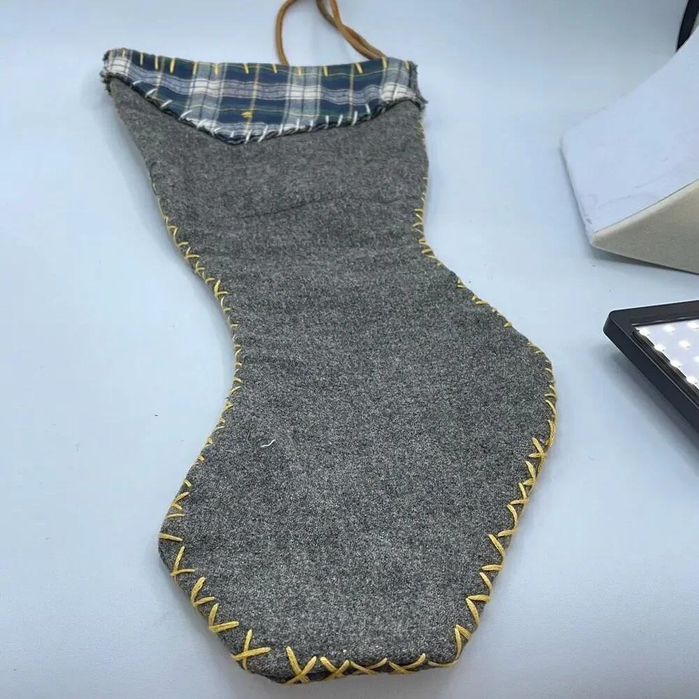 Vintage handmade grey wool Christmas stocking.